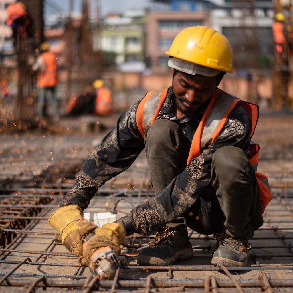 Two workers on a site during the day