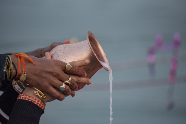couple offering water to the Lord Sun on Chhath festival