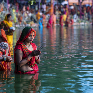 worshipping rising sun on Chhath puja at Ganga Sagar pond