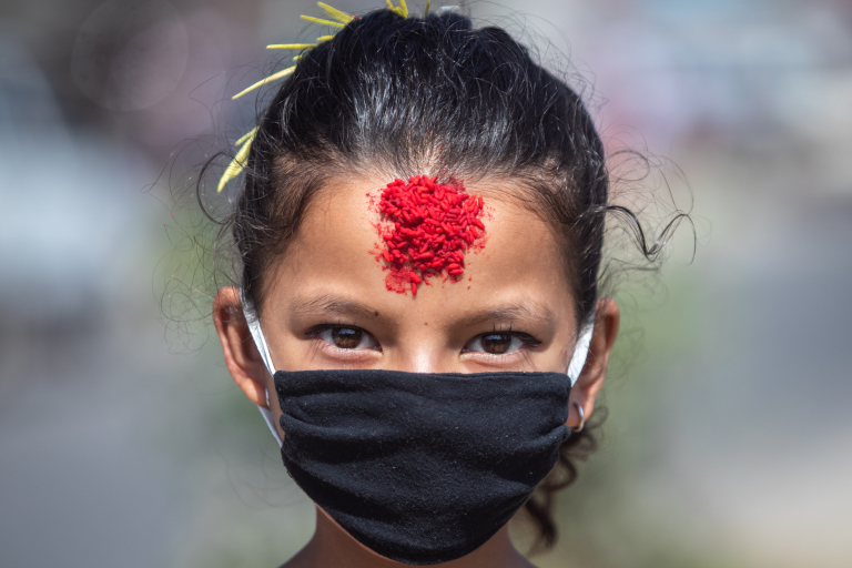 Dashain festival in Nepal: receiving tika and jamara
