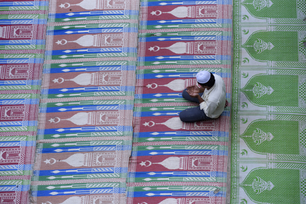 A Muslim man offers prayers on Ramadan