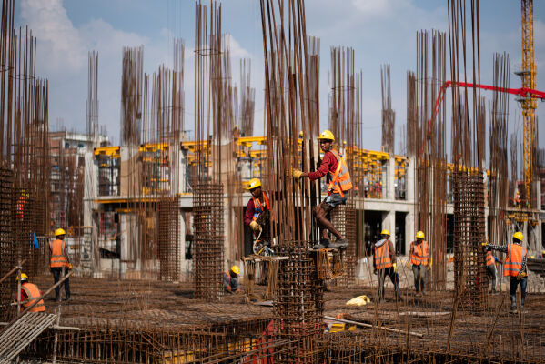 Nepalese workers working at a construction site