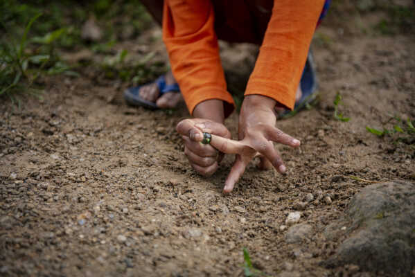 Kids playing marbles