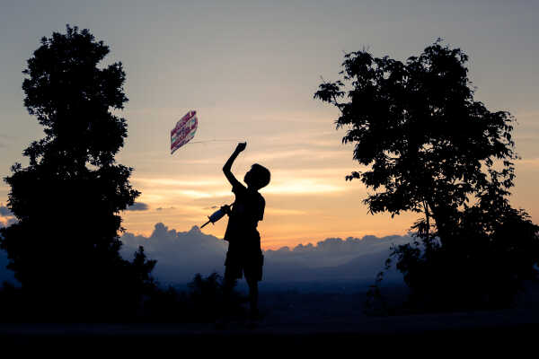 Kids Flying a Kite