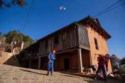 Two young boys playing with paper planes, Pipalchaur