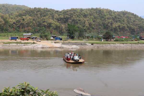 Vehicles Ferried Across the River