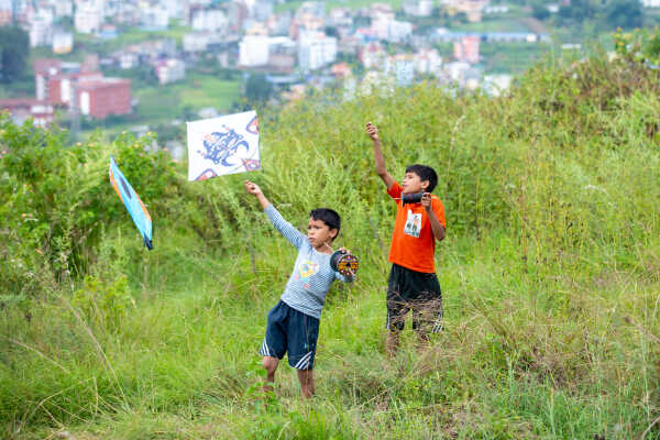 Kids Flying a Kite