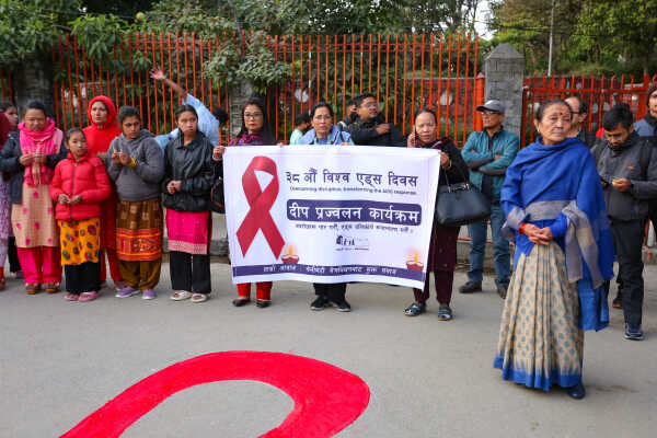 Maiti Nepal Lights Red Ribbon Candle Vigil on Eve of World AIDS Day
