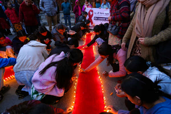 Maiti Nepal Lights Red Ribbon Candle Vigil on Eve of World AIDS Day