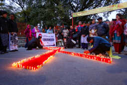 Maiti Nepal Lights Red Ribbon Candle Vigil on Eve of World AIDS Day