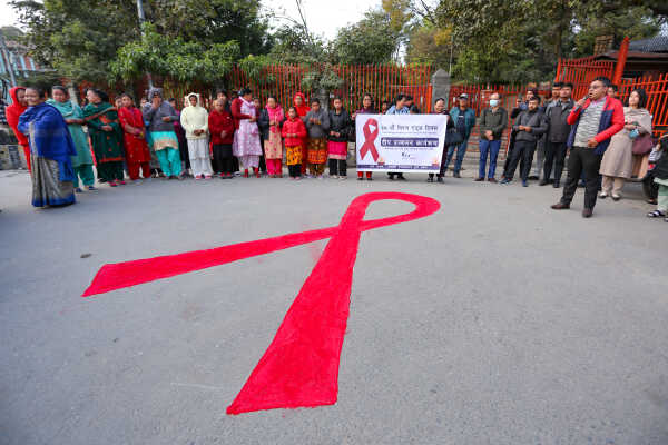 Maiti Nepal Lights Red Ribbon Candle Vigil on Eve of World AIDS Day