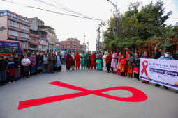 Maiti Nepal Lights Red Ribbon Candle Vigil on Eve of World AIDS Day