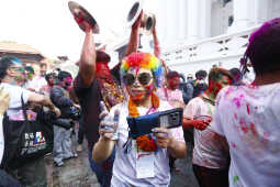 Foreign Tourists Join Holi Celebrations at Basantapur Durbar Square